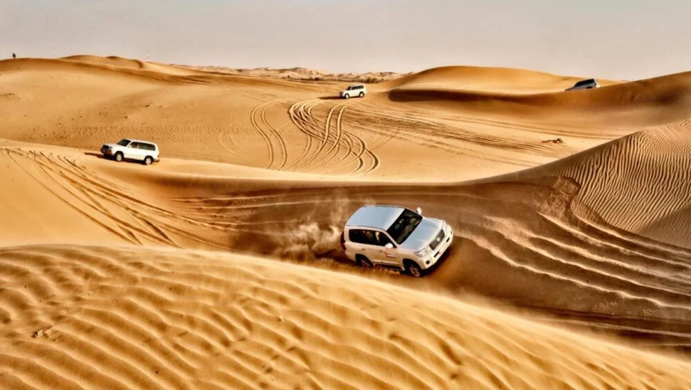 Luxury premium desert safari Dubai experience on golden sand dunes.